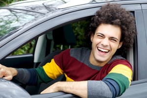 Young man driving car